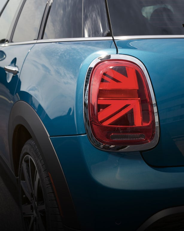 Closeup view of a Union Jack taillight on a blue MINI Hardtop 4 Door.